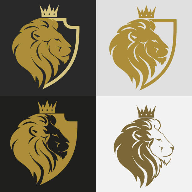 Lion head with crown logo Lion head with crown and shield logo, royal cat profile. Golden luxury emblem. Vector headwear stock illustrations