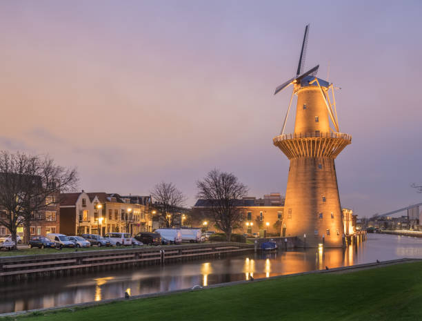 istock Old Dutch city landscape with windmill and canal 641296274