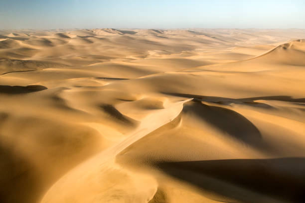 istock Large sand dunes in a desert from the air 641297256