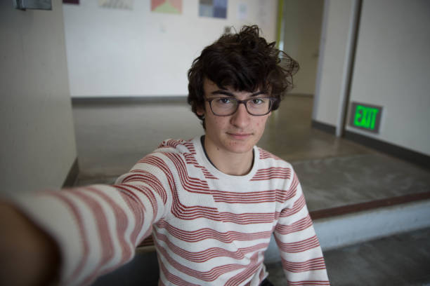 istock Teen Boy With Glasses Taking Selfie Smiling 641299224
