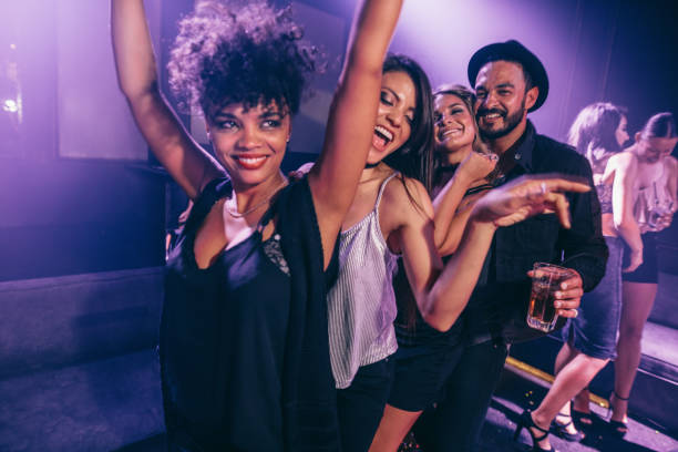 istock Friends dancing in night club 641300212