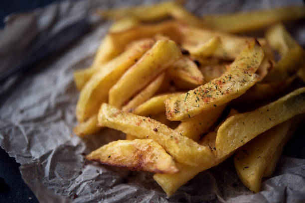 istock French fries on dark background 641300900
