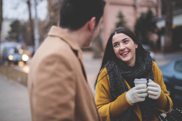 istock Young couple talking on the street 641301254