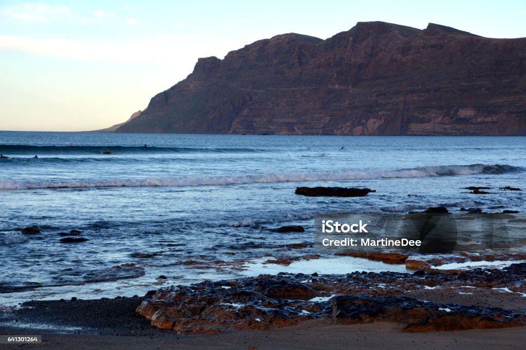 Landscape from Caleta de Famara, El Risco Mountain on Lanzarote. Canary Islands. Spain. Coastline scene Caleta de Famara beach from Lanzarote.Canary Islands.Spain. Atlantic Islands Stock Photo