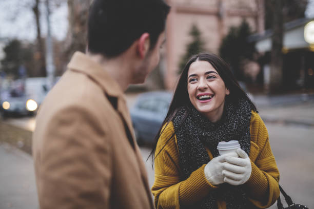 istock Young couple talking on the street 641301294