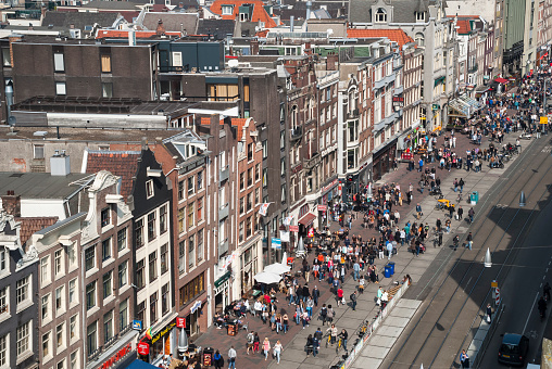 View of the crowded Damrak street in downtown Amsterdam, the Netherlands