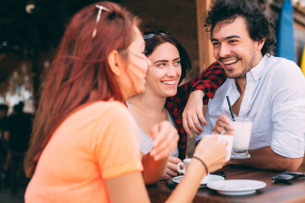istock Three friends at a beach bar 641305642