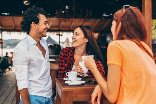 istock Three friends at a beach bar 641305650