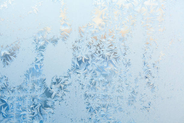 istock beautiful winter texture patterns of frost on window 641305896