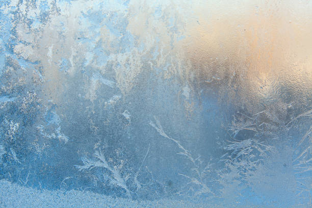 istock beautiful winter texture patterns of frost on window 641305940