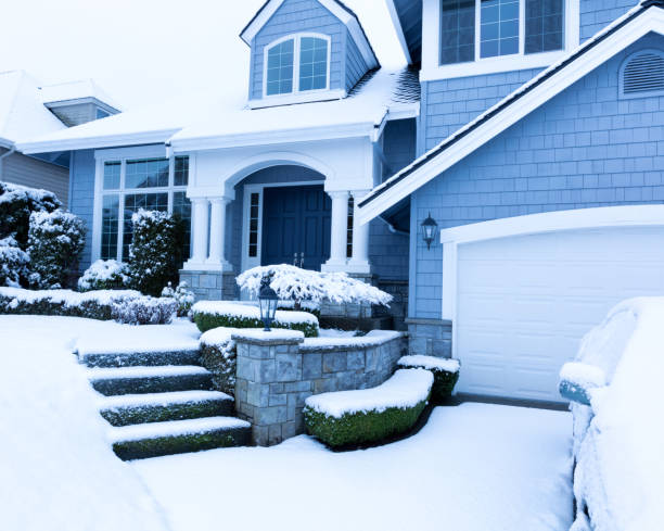 istock Snow covered sidewalk in front of home during winter snowfall 641307790