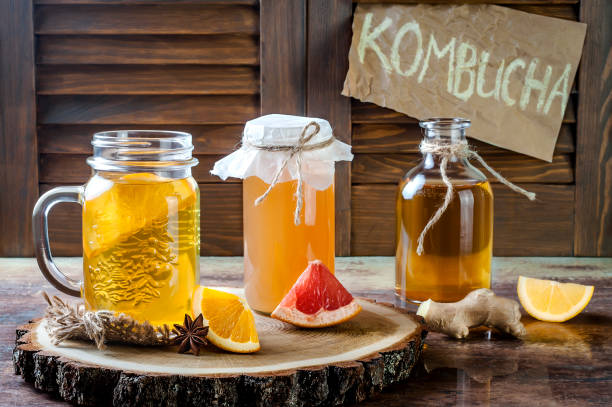 Homemade fermented raw kombucha tea with different flavorings. Healthy natural probiotic flavored drink. Homemade fermented raw kombucha tea with different flavorings. Healthy natural probiotic flavored drink. Copy space fermenting stock pictures, royalty-free photos & images