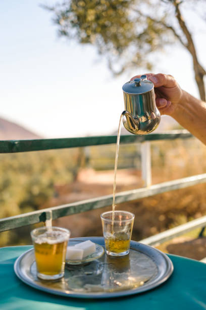 Preparation of mint tea, Moroccan style stock photo