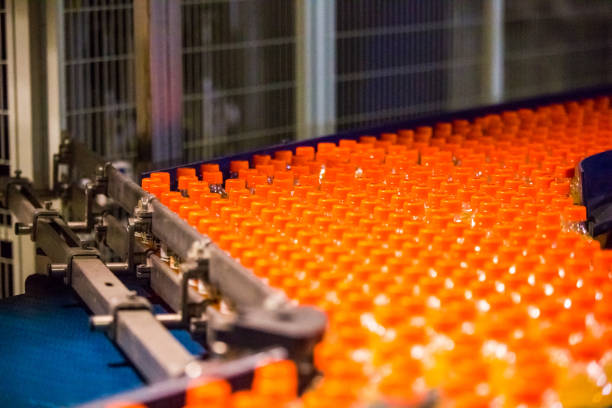 istock Bottles on Conveyor Belt in Factory 641310180