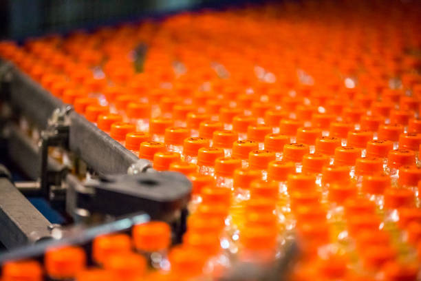 istock Bottles on Conveyor Belt in Factory 641310250