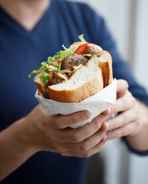 Half bread meat sandwich Half bread meat sandwich (typical Turkish style street food) deli sandwich wrapped stock pictures, royalty-free photos & images