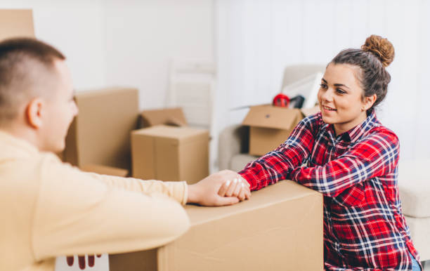 istock Young couple having fun while they moving into new home 641311240