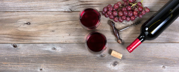 istock Unopen bottle of red wine and glasses 641311532