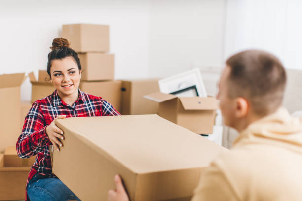 istock Young couple having fun while they moving into new home 641311538