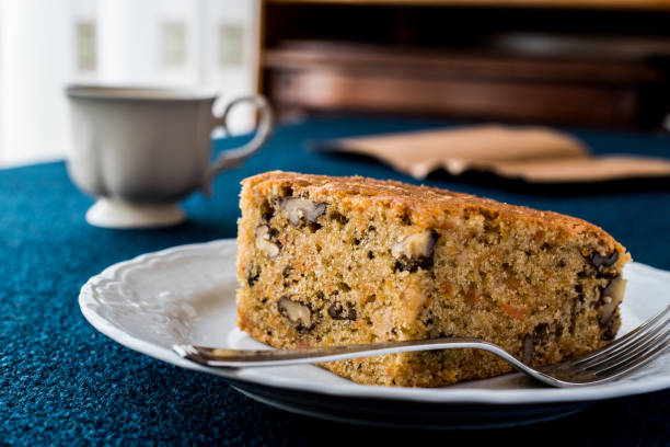 istock Carrot Cake with walnut, cinnamon and cup of tea or coffee 641313034