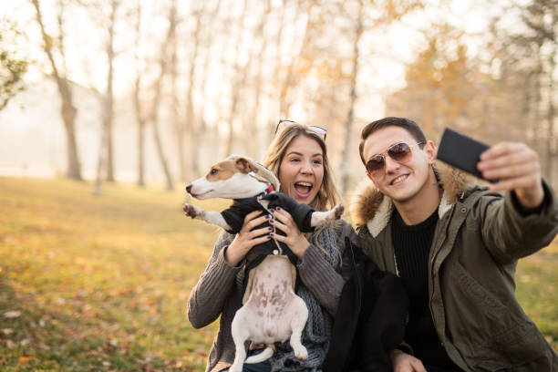 istock Young couple with their Jack Russell puppy 641313326