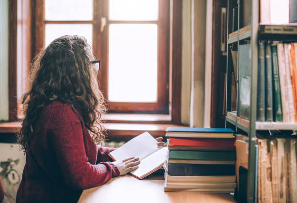 istock Young hipster woman relaxing while reading a book. 641313330