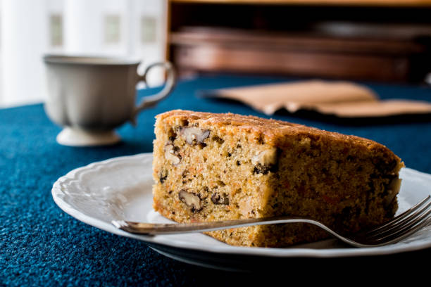 istock Carrot Cake with walnut, cinnamon and cup of tea or coffee 641314186
