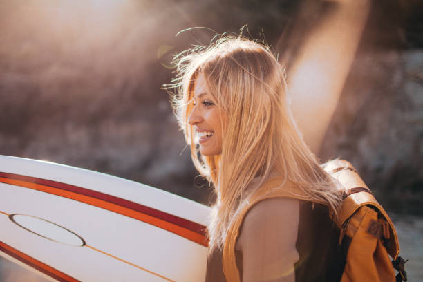 istock Smiling surfer girl 641314652