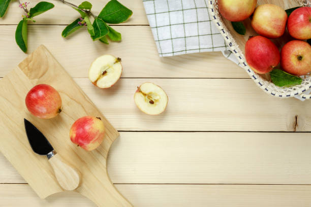 istock Top view red apple napkin,knift,basket on wooden. 641314934