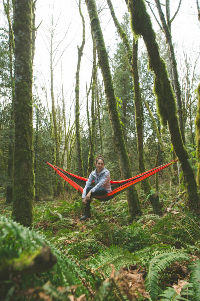 istock Young woman in hammock in forest 641320204