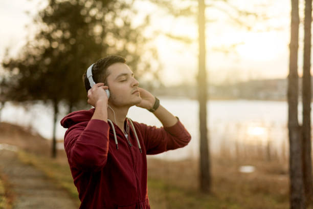 istock Listening to music while sun goes down 641322384
