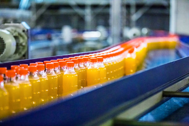 istock Bottles on Conveyor Belt in Factory 641323074