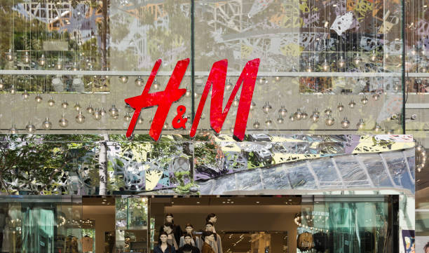 Famous Stores in Brisbane I Illustrative editorial photo of a H & M store in Brisbane central retail mall. h and m stock illustrations