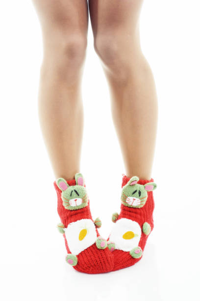 istock woman legs in red socks 641325442