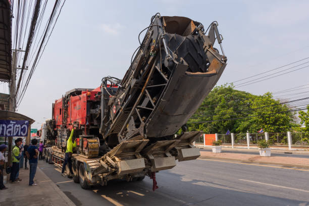 Sugar cane harvesters on trailer truck for move to work. Ang Thong, Thailand - May 2, 2016 : Sugar cane harvesters on trailer truck for move to work. machinerie stock pictures, royalty-free photos & images