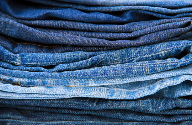 istock Stack of the blue jeans close-up 641325978
