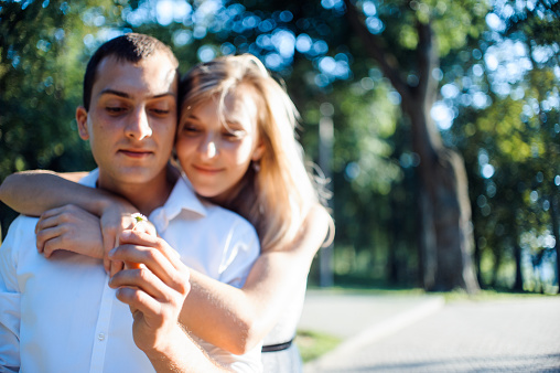 Portrait of a young romantic couple embracing each other