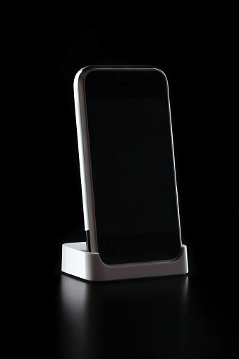 A Phone standing on Black Background