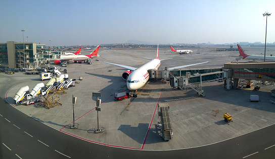 Mumbai, India - February 8, 2017: Several Air India airplanes sitting on the tarmac at the Mumbai International airport in India.
