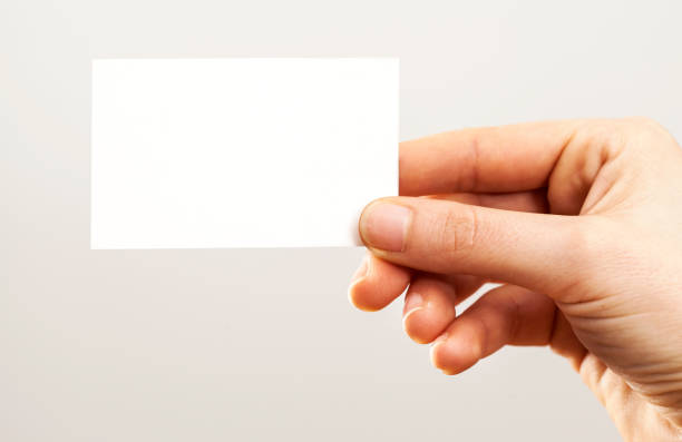istock Woman hand holding blank business card 641330568