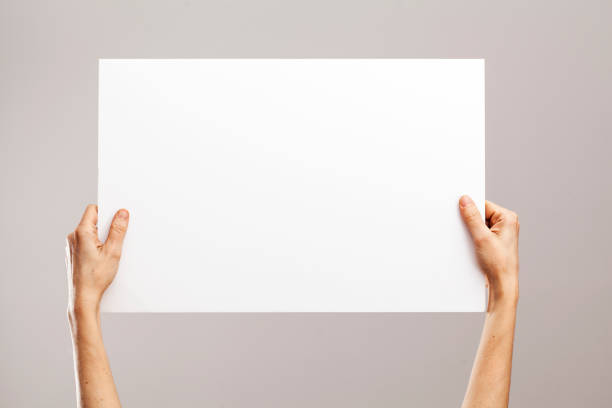 istock Young woman hands holding cardboard 641330654