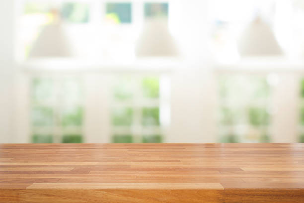 istock Empty wooden table and modern  background with green ourdoor view 641333840