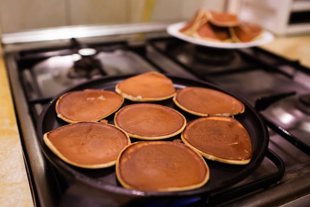 Cooking pancakes in the kitchen. Shrovetide, pancake week