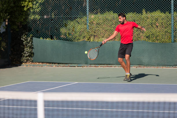 istock Tennis player man hitting ball in a volley. 641337176