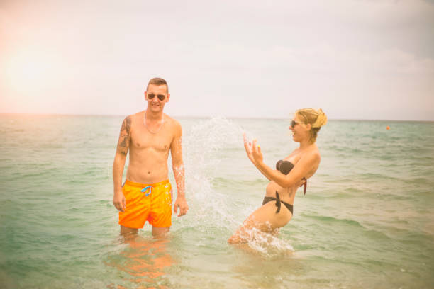 istock happy couple on the beach 641337940