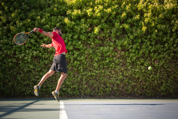 istock Tennis player man hitting ball in a volley. 641338618