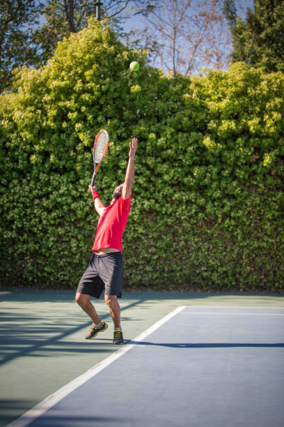 istock Tennis player man hitting ball in a volley. 641339266