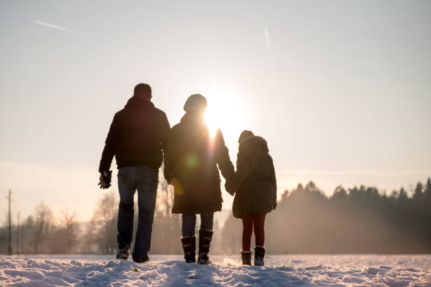 istock Young family watching how the sun goes down 641339552