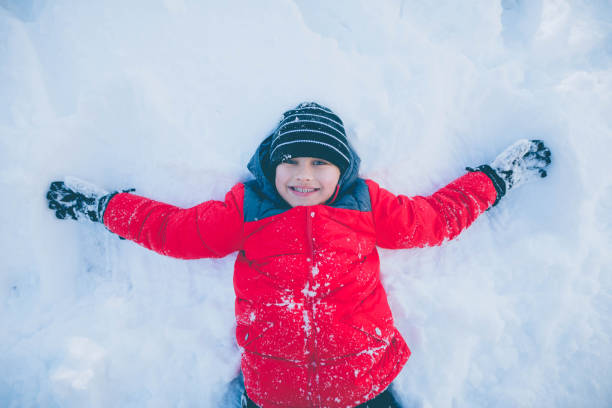 istock Young woman playing in snow 641339824