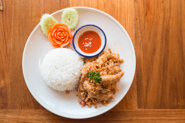 istock Thai food, Fried garlic mix with pork serve with rice 641341048